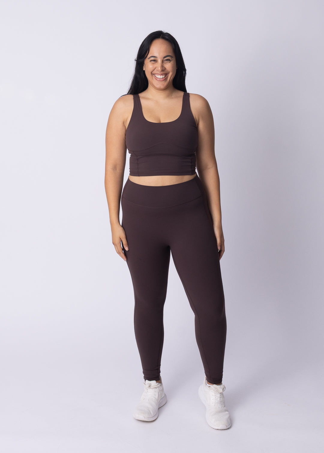 Woman wearing Moments High Waisted Leggings with Moments Longline Sports Bra — full Womene activewear set