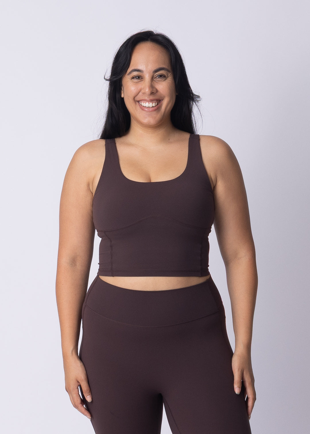 Woman wearing Womene Moments Longline Sports Bra in Coffee Brown — Australian activewear