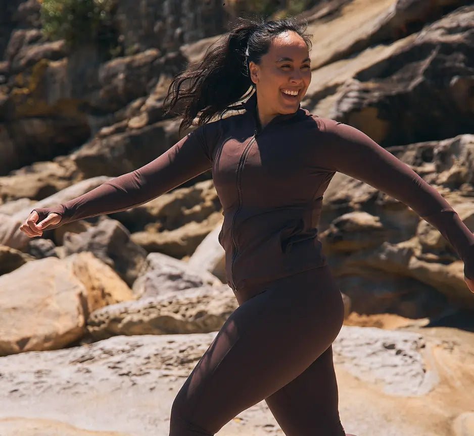 Woman in Womene Moments Zip Jacket and leggings in coffee brown, Australian premium activewear