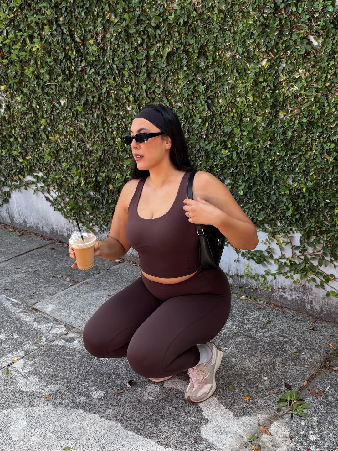 Woman in a deep squat wearing Womene Moments high waisted squat-proof leggings, fabric staying opaque through the movement