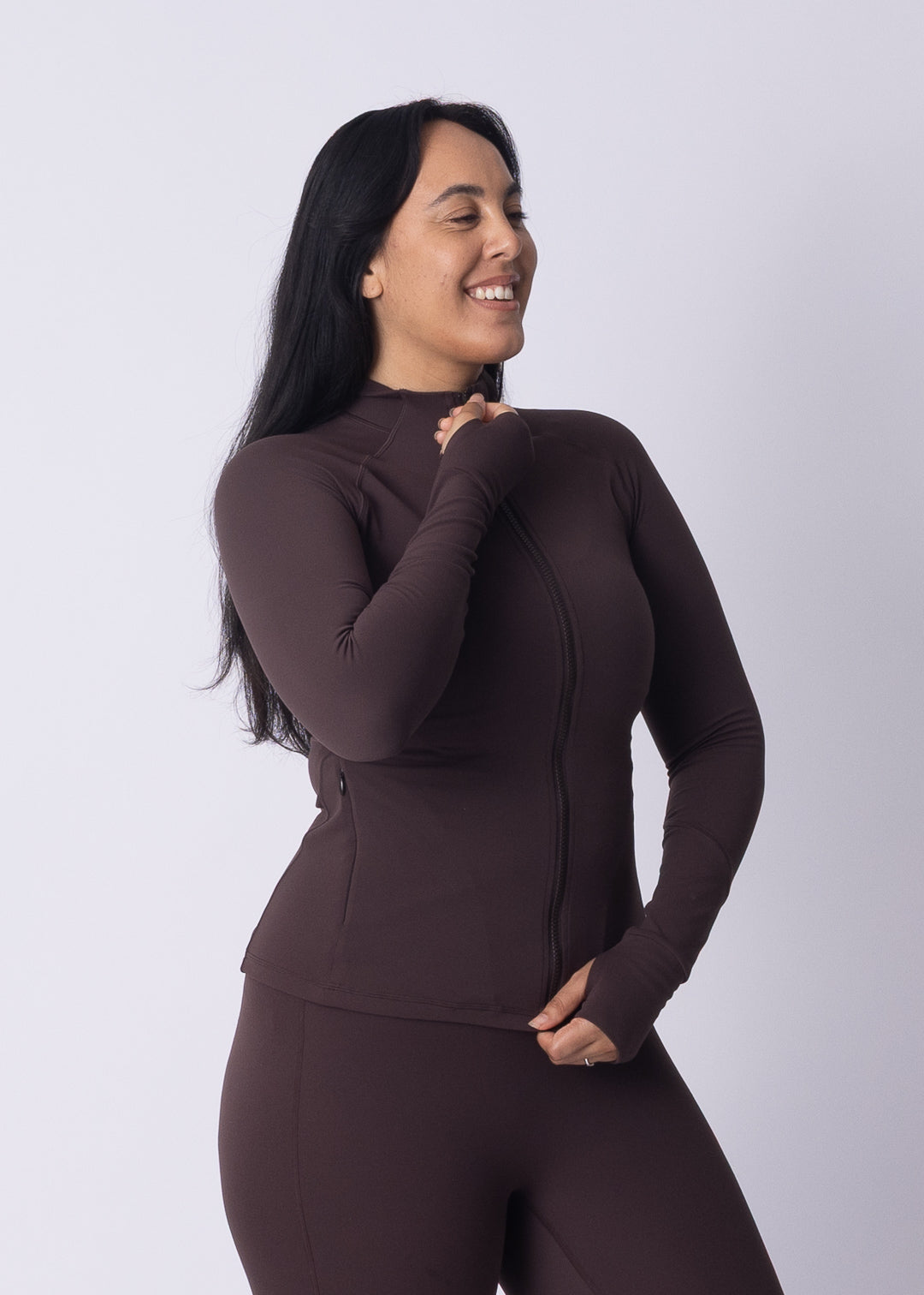 Woman wearing Moments Zip Jacket with Moments Leggings — full Womene activewear set