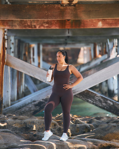 Woman wearing Womene Moments High Waisted Leggings in Coffee Brown — Australian activewear